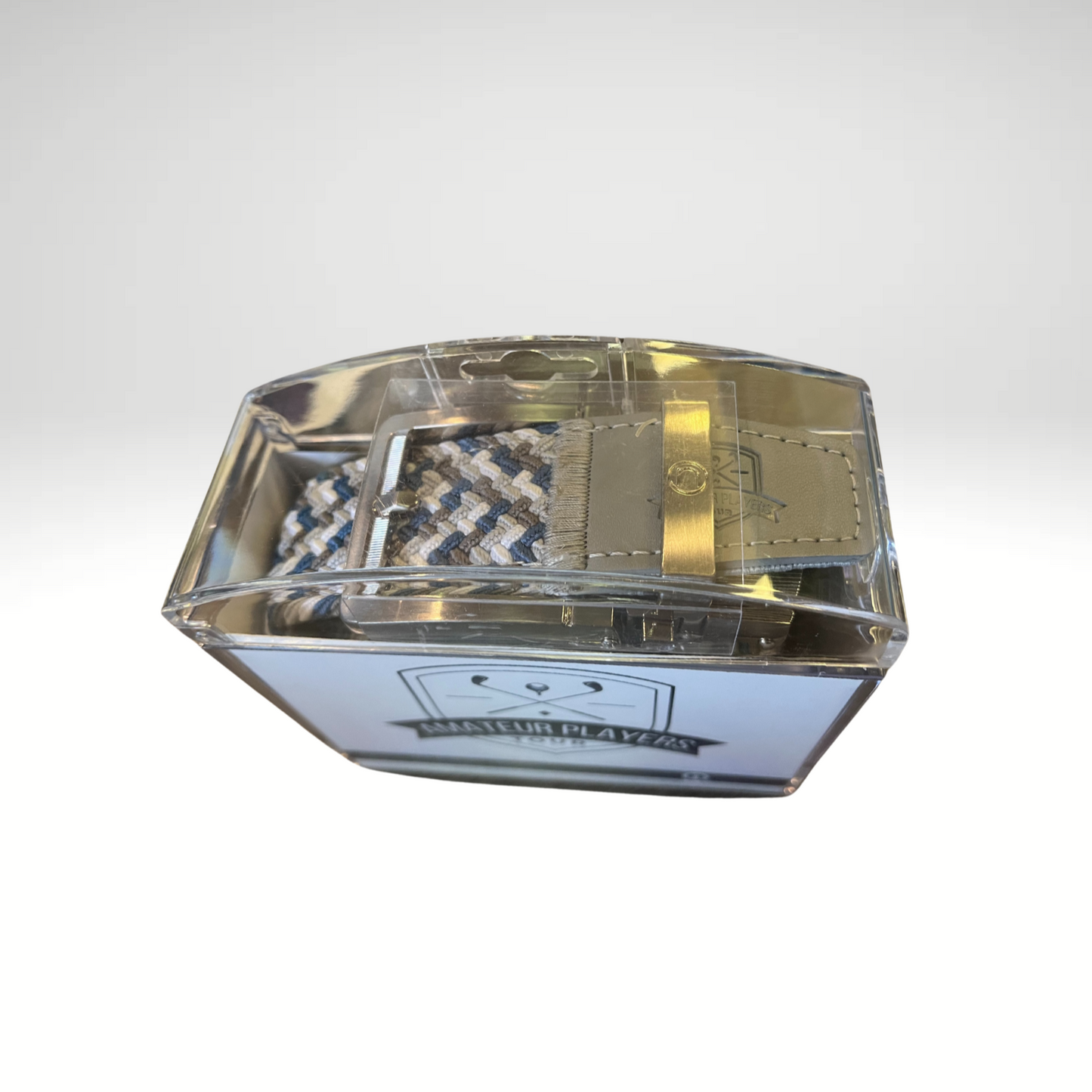 A braided golf belt, featuring a tricolor design and stamped APT logo.