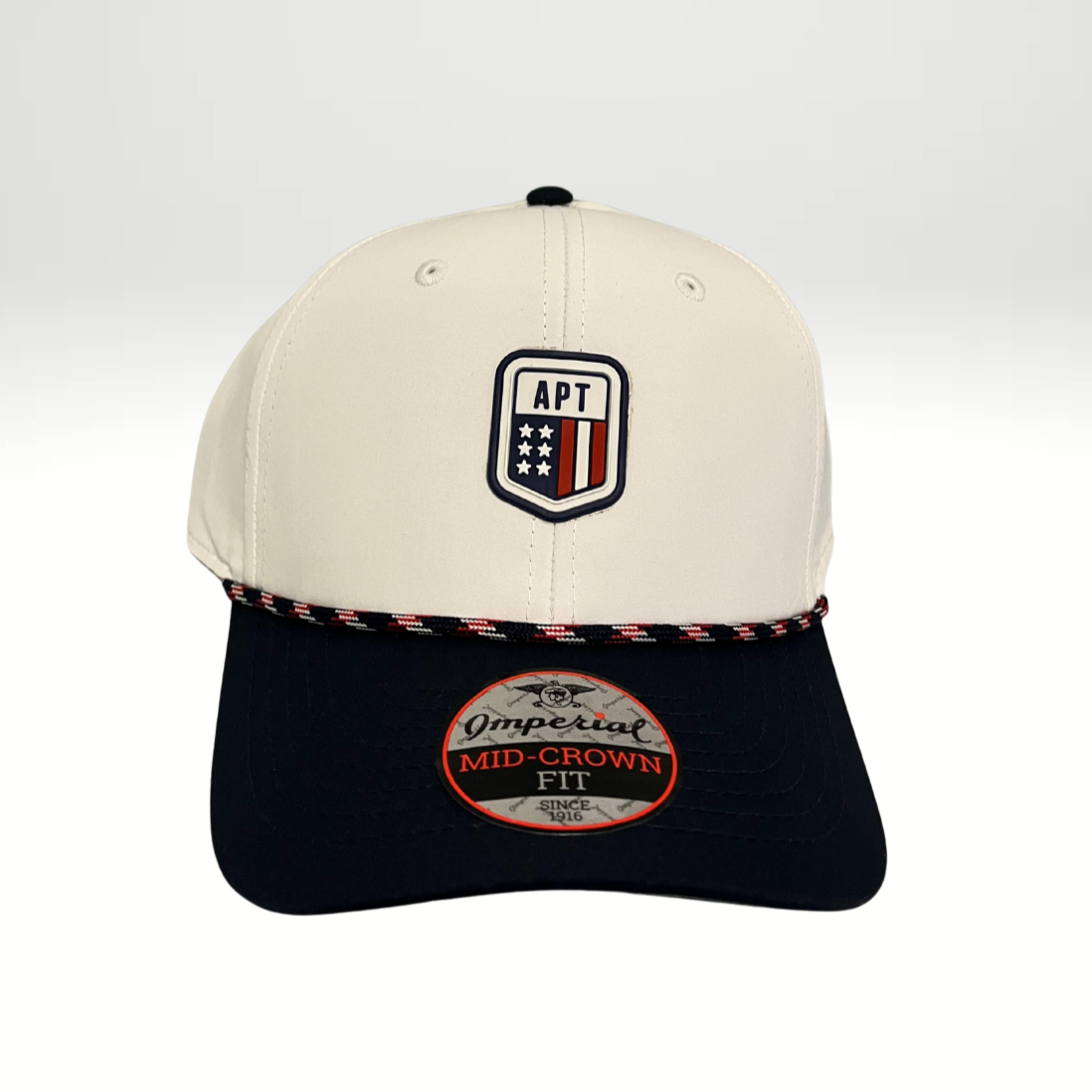 A two-tone performance rope cap with a beige front panel and black base, featuring a plastic snap closure and a woven rope detail along the base of the front panel.