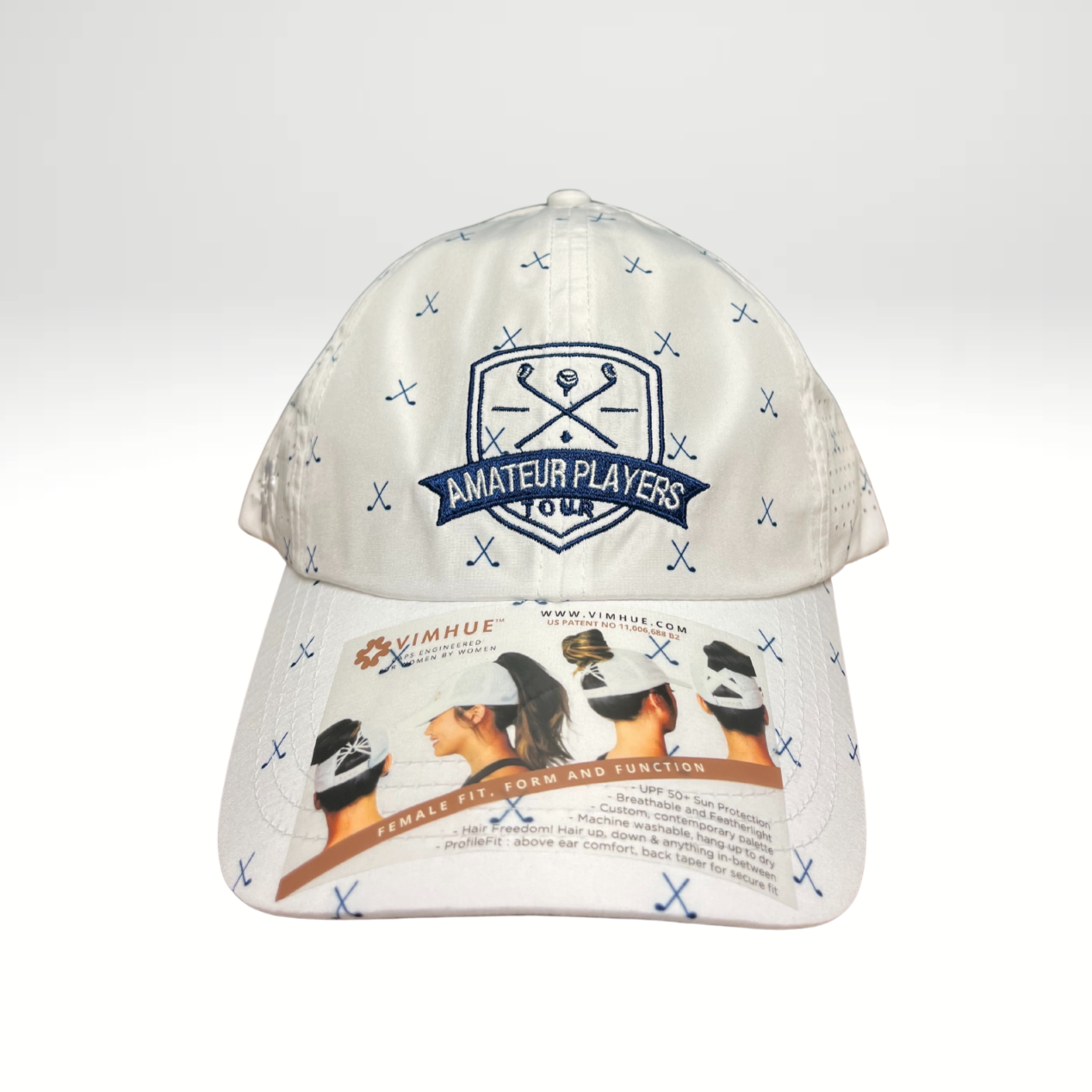 A white golf hat with a pattern of golf clubs and balls, featuring a logo at the top.