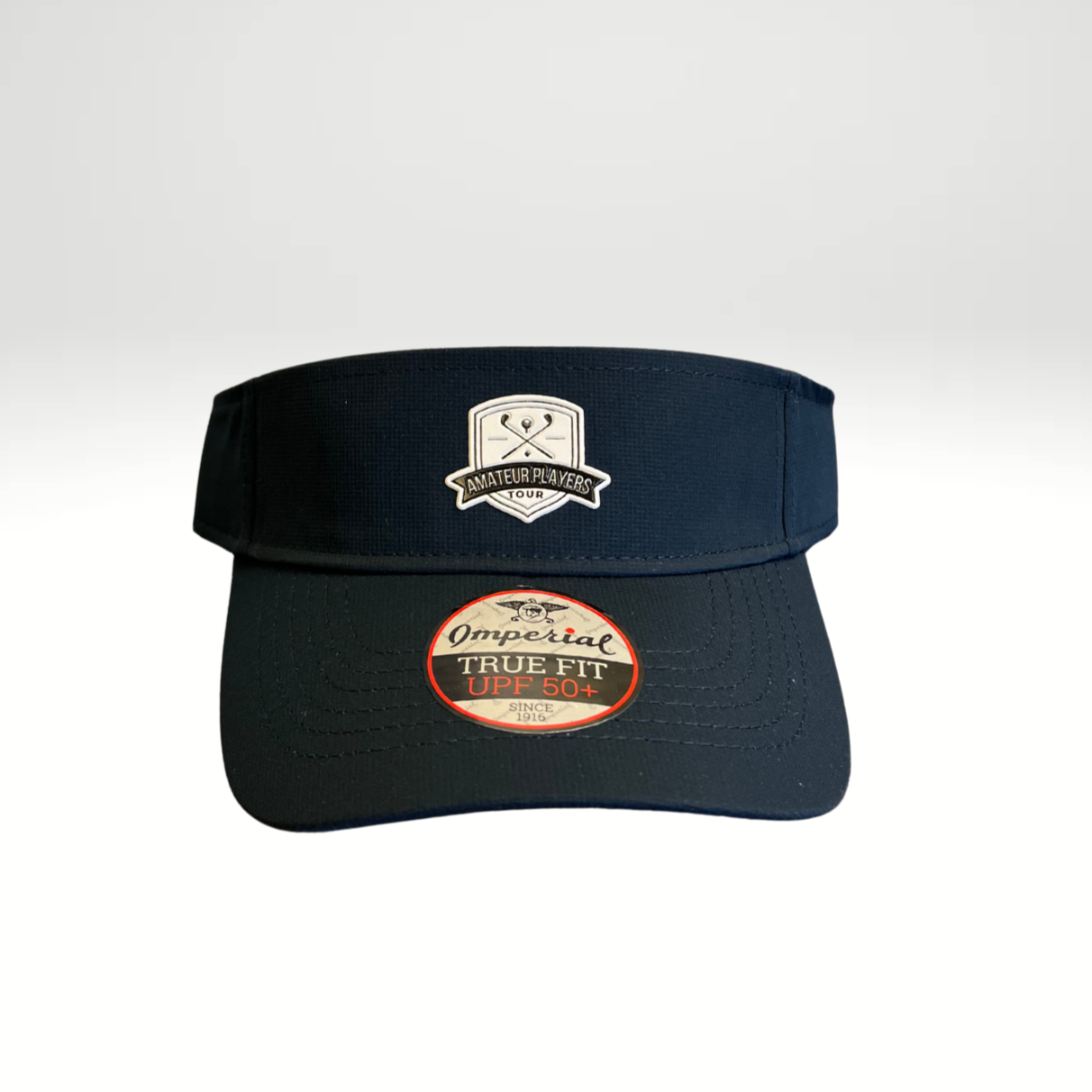 A navy performance visor with a low profile crown and a micro hook & loop elastic loop closure.