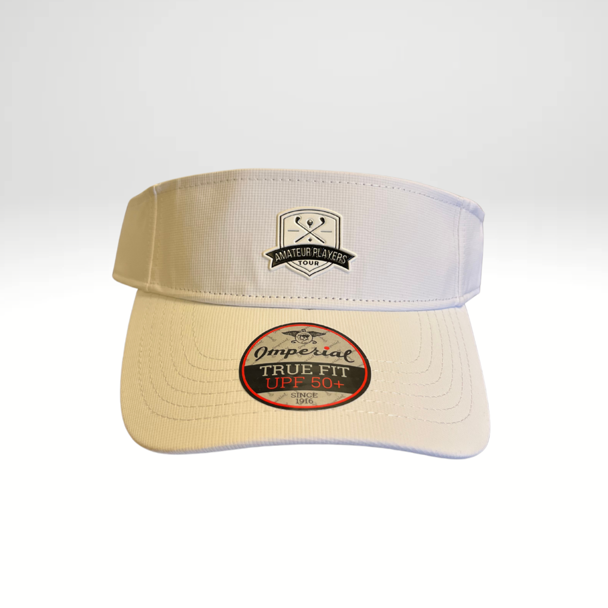 A White performance visor with a low profile crown and a micro hook & loop elastic loop closure.